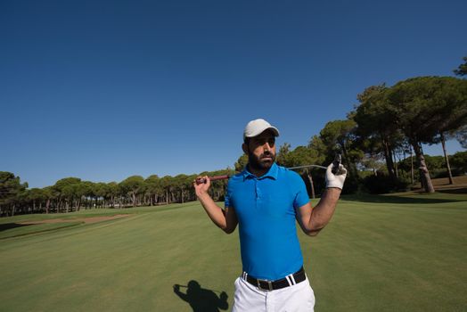 handsome middle eastern golf player portrait at course at sunny day