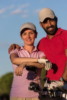 portrait of happy young  couple on golf course