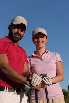 portrait of happy young  couple on golf course