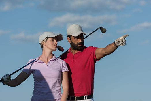 portrait of happy young  couple on golf course