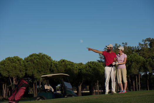 portrait of happy young  couple on golf course