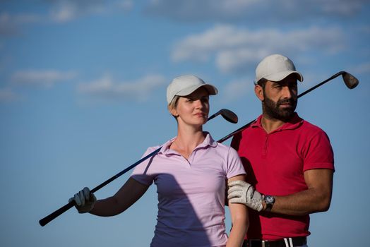 portrait of happy young  couple on golf course