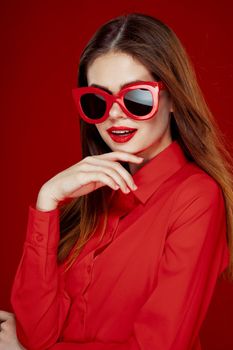 cheerful woman in a red shirt sunglasses Glamor close-up. High quality photo