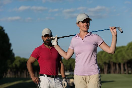 portrait of happy young  couple on golf course