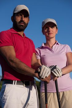 portrait of happy young  couple on golf course