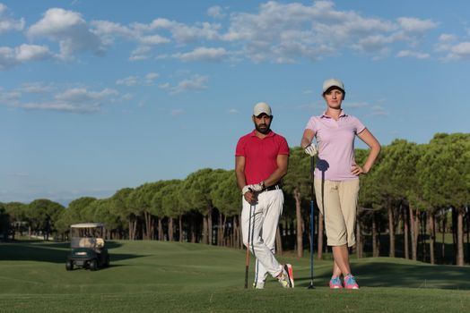 portrait of happy young  couple on golf course