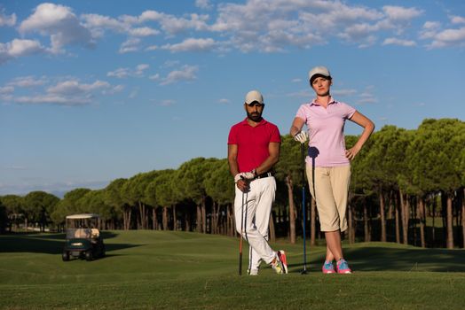 portrait of happy young  couple on golf course