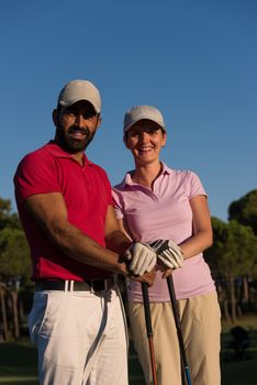 portrait of happy young  couple on golf course