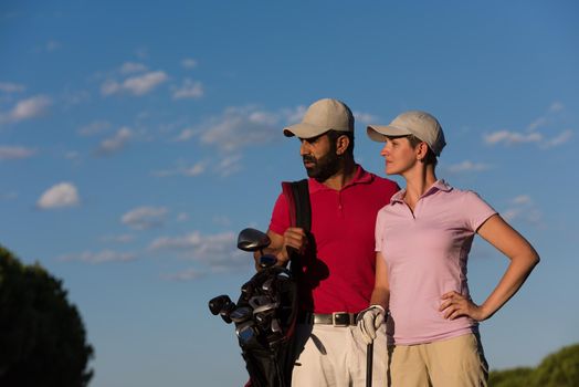 portrait of happy young  couple on golf course