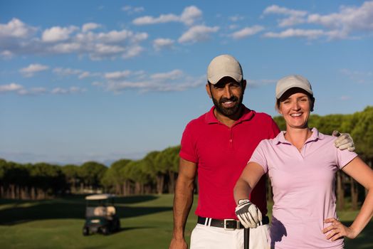 portrait of happy young  couple on golf course