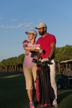 portrait of happy young  couple on golf course