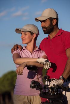 portrait of happy young  couple on golf course