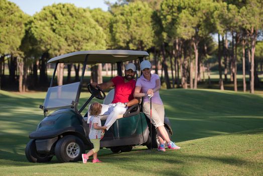 couple in buggy cart on golf course