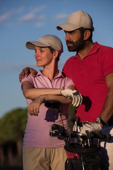 portrait of happy young  couple on golf course