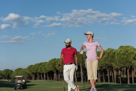 portrait of happy young  couple on golf course