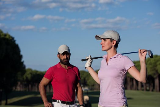 portrait of happy young  couple on golf course