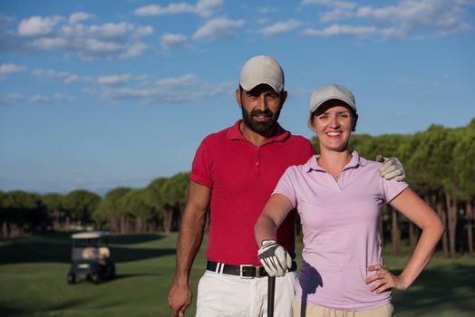 portrait of happy young  couple on golf course