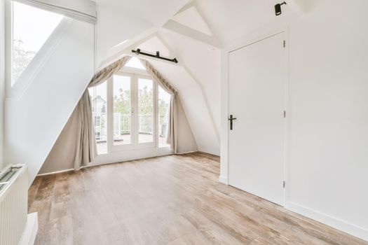Large doors of unusual shape leading to the balcony