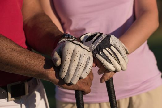 portrait of happy young  couple on golf course