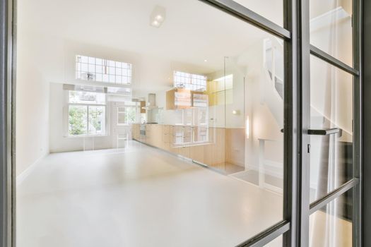 View from glass door to modern kitchen