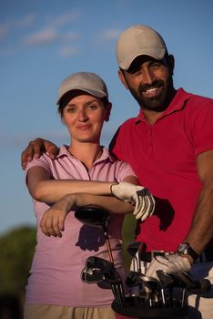 portrait of happy young  couple on golf course