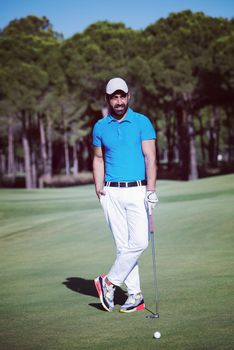 handsome middle eastern golf player portrait at course at sunny day