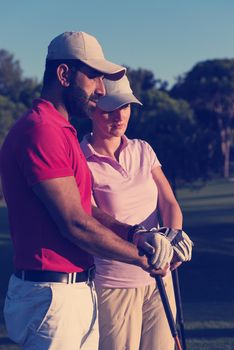 portrait of happy young  couple on golf course