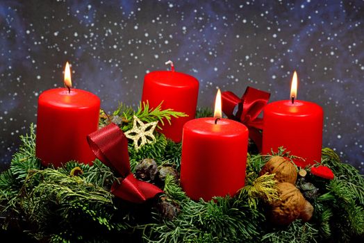 advent wreath with 3 burning candles