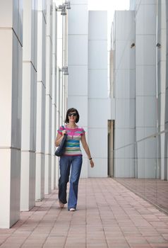 Beautiful woman  outdoor modern city urban street scene with abstract  glass reflections