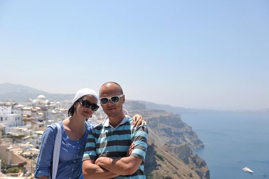 young couple portrait in love have romantic time on summer vacation holidays in greece santorini