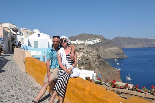 young couple portrait in love have romantic time on summer vacation holidays in greece santorini