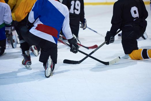 ice hockey players team group meeting with trainer  in sport arena indoors