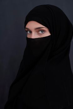 Portrait of muslim woman wearing niqab and traditional arabic clothes or abaya. Arab woman representing modern arabic lifestyle, islamic  fashion and Ramadan kareem concept