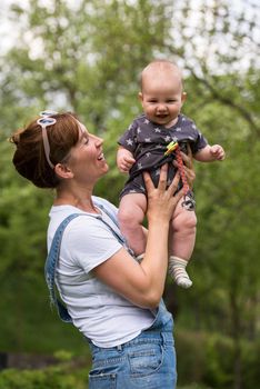 woman with baby have fun in nature