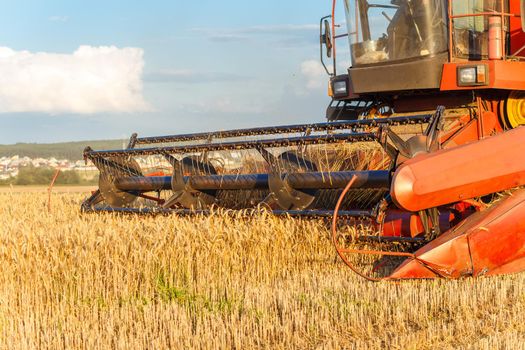 combine harvester working on a wheat field