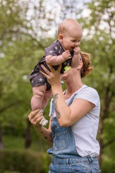 woman with baby have fun in nature