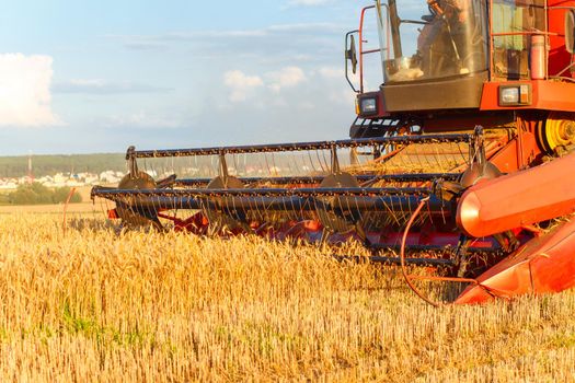 combine harvester working on a wheat field