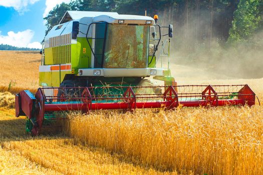 combine harvester working on a wheat field