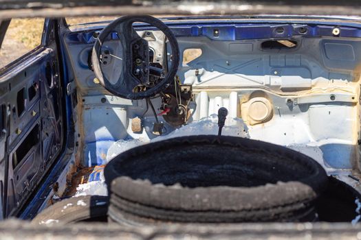 Inside a burnt-out passenger car. The remains of the foam that firefighters used to extinguish the fire.