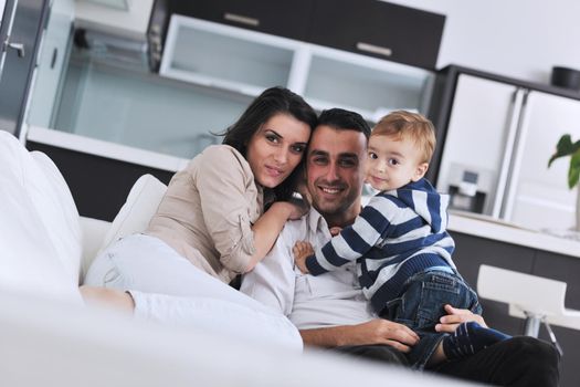 happy young family have fun and relaxing at new home with bright furniture