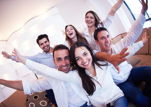 group of friends taking selfie photo with tablet at modern home indoors