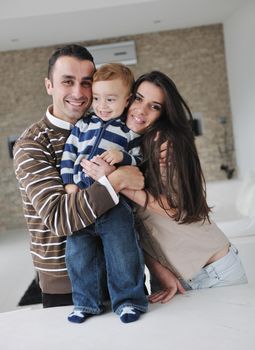 happy young family have fun and relaxing at new home with bright furniture