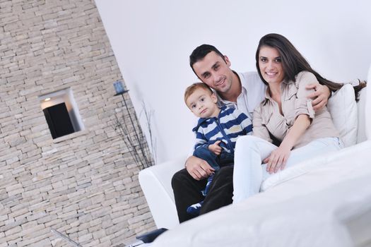 happy young family have fun and relaxing at new home with bright furniture