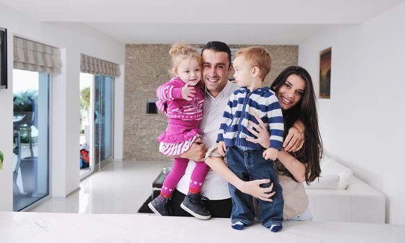 happy young family have fun and relaxing at new home with bright furniture