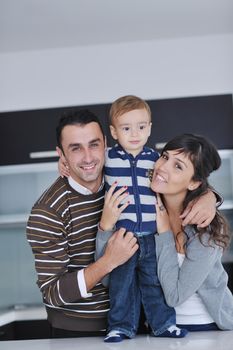 happy young family have fun and relaxing at new home with bright furniture