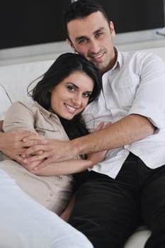 happy young couple relax at modern home living room indoor