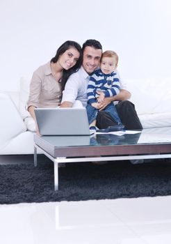 happy young family have fun and relaxing at new home with bright furniture