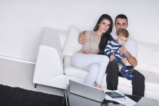 happy young family have fun and relaxing at new home with bright furniture