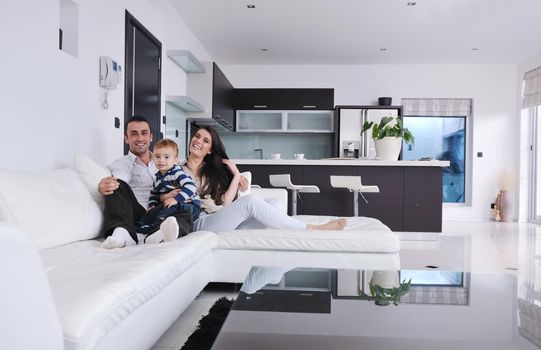 happy young family have fun and relaxing at new home with bright furniture