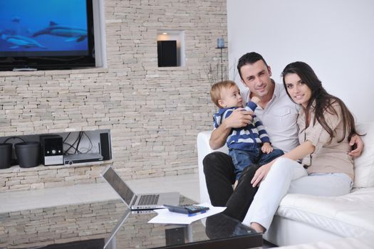 happy young family have fun and relaxing at new home with bright furniture